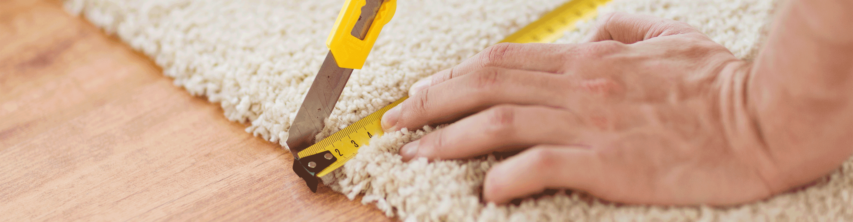 carpet being measured and cut during installation